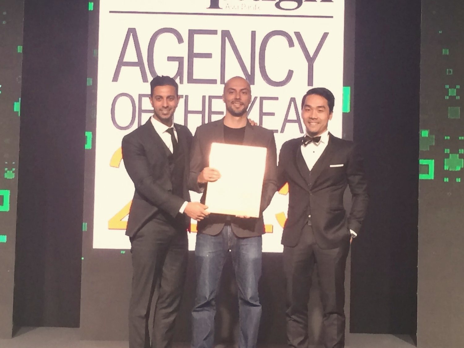 Ly on stage accepting Agency of the Year